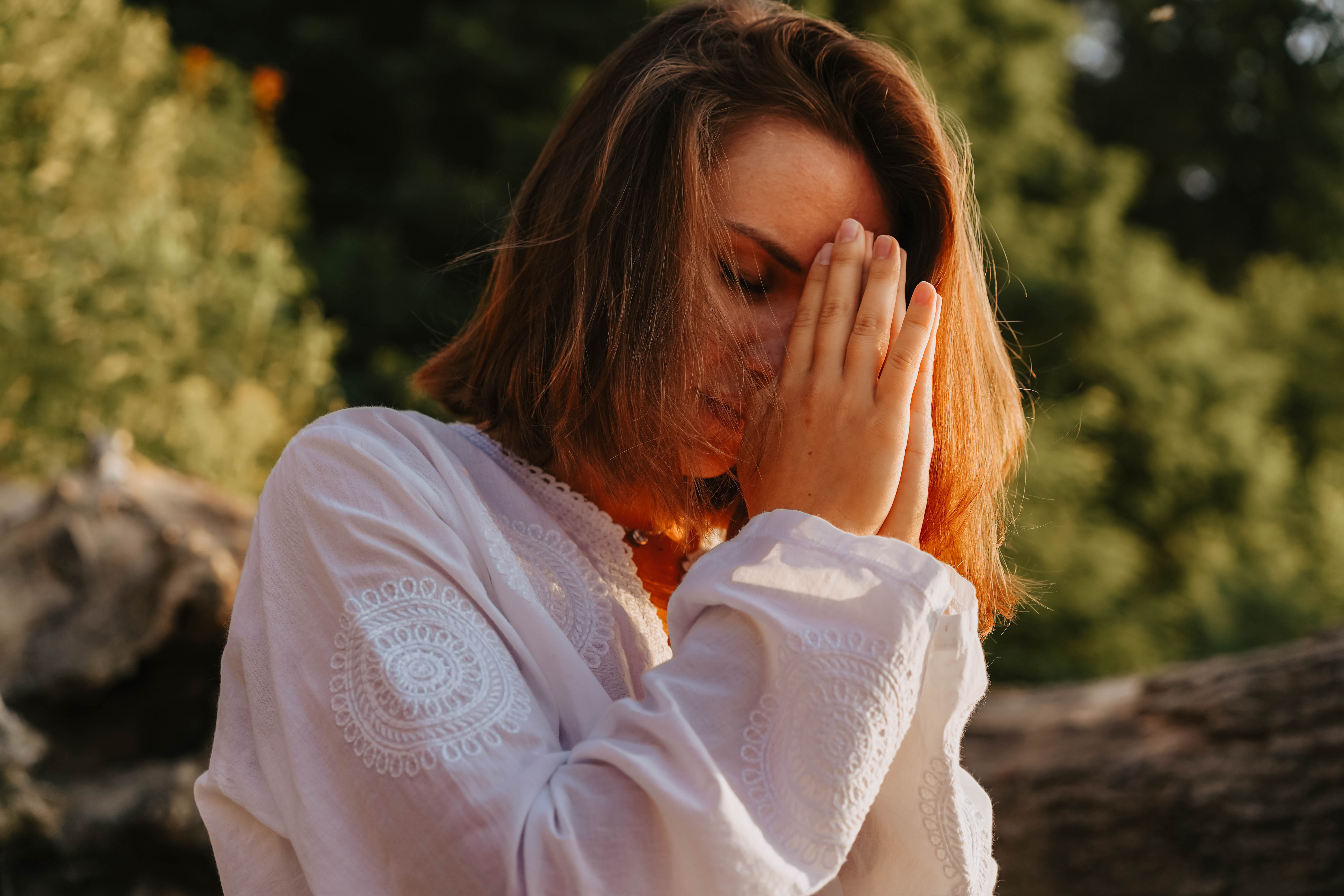 woman praying outdoors