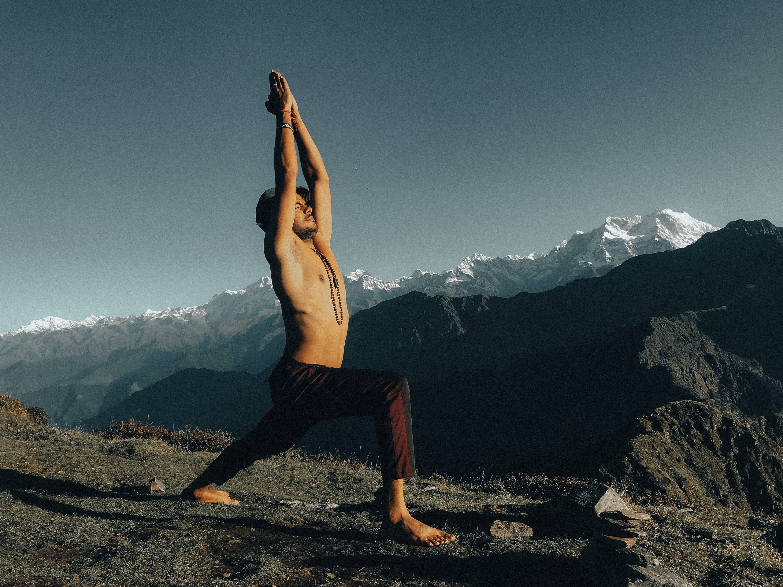 Warrior pose on mountain